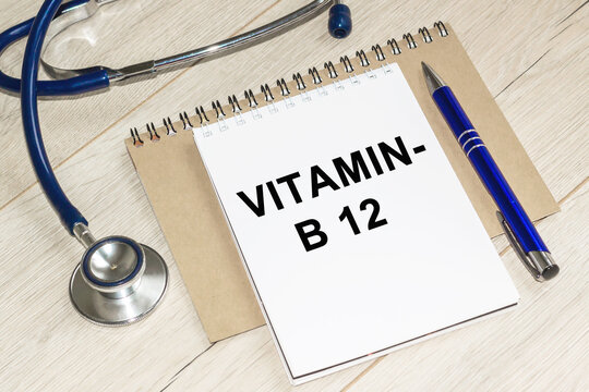 Medicine and health concept. On a table lies a stethoscope, WITH notebook. VITAMIN B-12