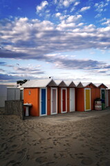Fototapeta na wymiar Colorful cabins on the beach