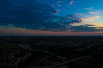 Sunset or dawn sky over the city from a bird's eye view