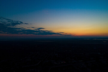 Fototapeta premium Sunset or dawn sky over the city from a bird's eye view