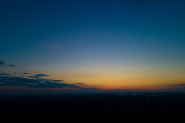Sunset or dawn sky over the city from a bird's eye view
