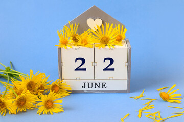Calendar for June 22: cubes with the number 22 , the name of the month of June in English, a...