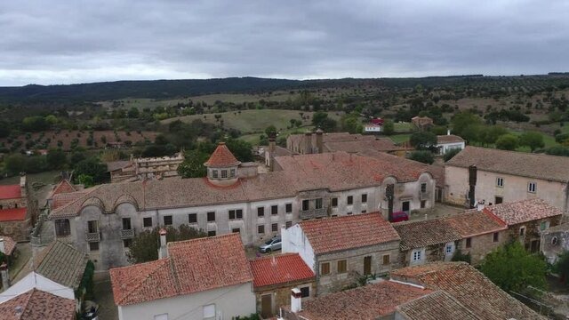 Drone aerial view of Idanha a velha historic village and landscape with Monsanto on the background, in Portugal