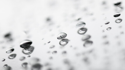 Blurred background with water drops on glass. Macro closeup
