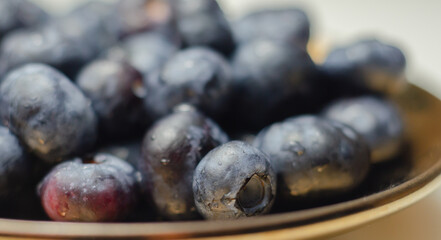 Closeup on fresh and ripe blueberries on a white background