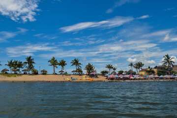 Obraz premium Barra de Navidad mangrove coast with tourists posing in the sun