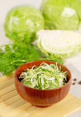 Obraz na płótnie Canvas Fresh vegetable salad with cucumber and cabbage
