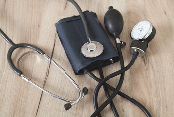 Pressure device on a wooden background.