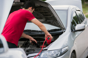 Fototapeta na wymiar How to, charge car battery for emergency broken car .