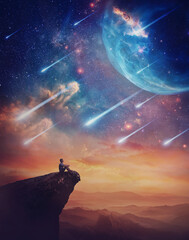 Lone person on the peak of a cliff admiring a wonderful space phenomenon. Fantastic scenery with...