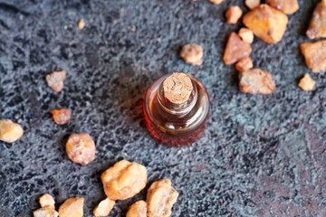 A bottle of styrax benzoin essential oil with benzoin resin. Alternative therapy..