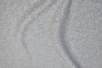 Fototapeta na wymiar Close-up texture of natural gray fabric or cloth in gray color. Fabric texture of natural cotton or linen textile material. Gray canvas background.