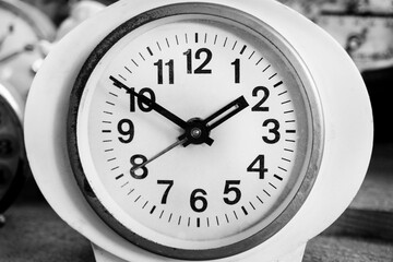  black and white clock, alarm clock,Old Vintage antique clock, Retro styled clock, time concept. Close-up.  Black and white classic photo