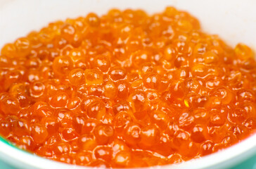 Red salmon caviar background. Luxury delicacy seafood. Close up.