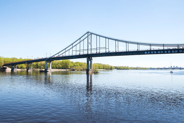 Fototapeta na wymiar Bridge over the Dnieper in the city of Kiev.Beautiful landscape on the river with a bridge.