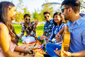 indian students having a lunch in Delhi park outdoors