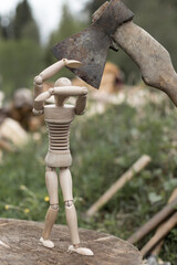 Murder or execution concept, wooden man and axe.