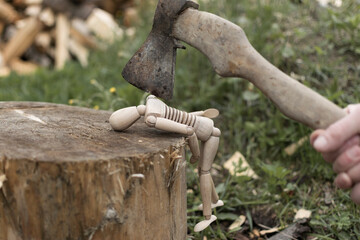 Murder or execution concept, wooden man and axe.