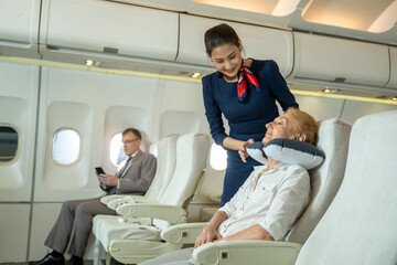 Cabin crew or air hostess takes care of passengers in planes,Airline transportation and tourism concept.