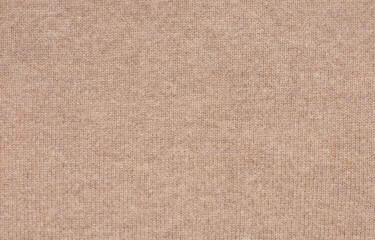 Fototapeta na wymiar Texture of natural beige woolen fabric close-up. the background for your mockup