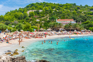 HVAR, CROATIA, AUGUST 8 2019: The beautiful Pokoniji Dol Beach in Hvar Island, Adriatic Sea - obrazy, fototapety, plakaty