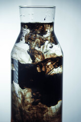 Bottle with water, ink and oil