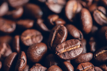 Fresh roasted coffee beans background, Dark tone, Selective focus.