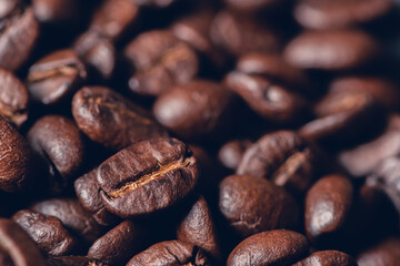 Fresh roasted coffee beans background, Dark tone, Selective focus.