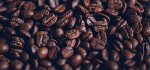 Fresh roasted coffee beans background, Dark tone, Selective focus.