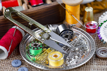 Threads, needles and sewing items.