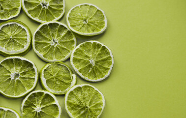 Dried lime slices on colorful background.