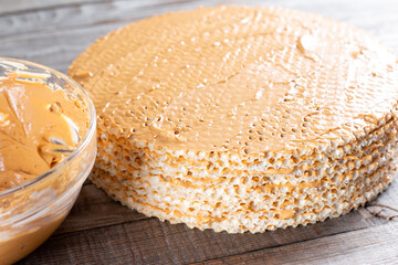 Step by step, making a waffle cake, with condensed milk, cocoa and butter.