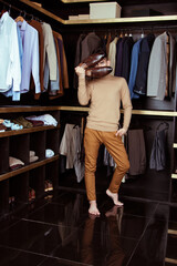 Elegant look. Handsome man in a beige suit standing. Styles, trendy, men's wardrobe.