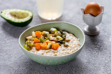 Oatmeal with fruits, candied fruits and nuts