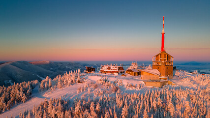 Winter sunrise on Lysa Hora mountain. Th highest peak of Beskydy mountains in the east part of Czech Republic. High quality aerial panorama. - 438692861