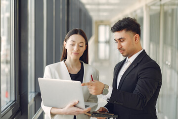 Businessman with his partner working in a office