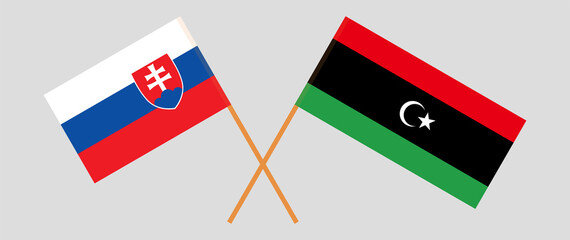 Crossed flags of Slovakia and Libya. Official colors. Correct proportion