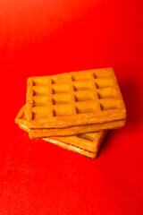 Hungarian waffles close-up on a red background