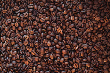 Roasted coffee beans for background, high quality dark roasted coffee structure. High quality photo