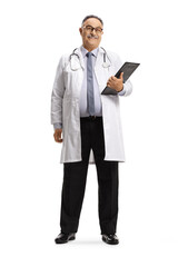 Full length portrait of a mature male doctor standing with a clipboard and smiling