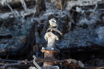 Burned down car, abstract background, selective focus. The situation of protests in the world.