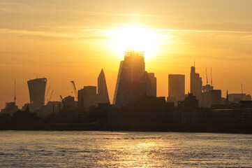 Sunset over the silhouette of City of London, England, United Kingdom, UK