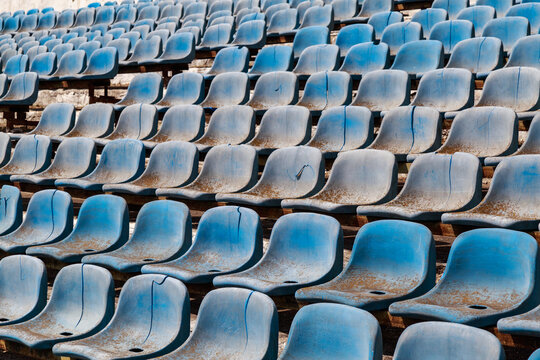 Destroyed stadium stands. Broken fan chairs. Selective focus