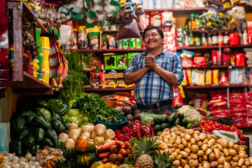  Grocery store in Guatemala and a happy man with his hands in a praying position.