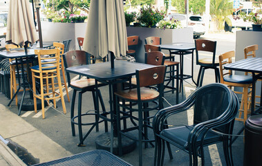 Fototapeta na wymiar Outdoor dining patio with tables and chairs