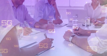 Animation of 5g text, scopes scanning and data processing over businessmen in meeting - Powered by Adobe