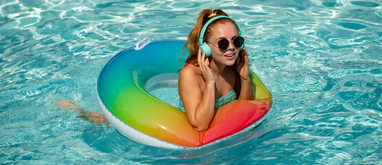 Summer mood concept. Pool resort. Girl on swim ring. Summertime days.