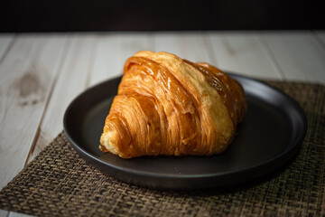 Croissant bakery on white wooden table