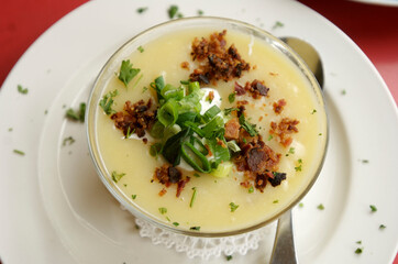 Potato soup with bacon and sour cream.  At a diner style restaurant.