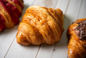 Croissant bakery on white wooden table